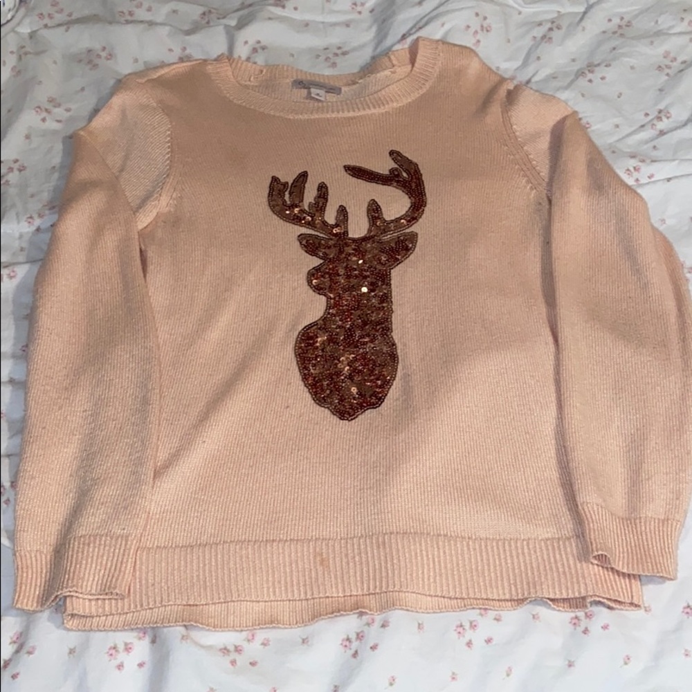 Pink sweater with reindeer